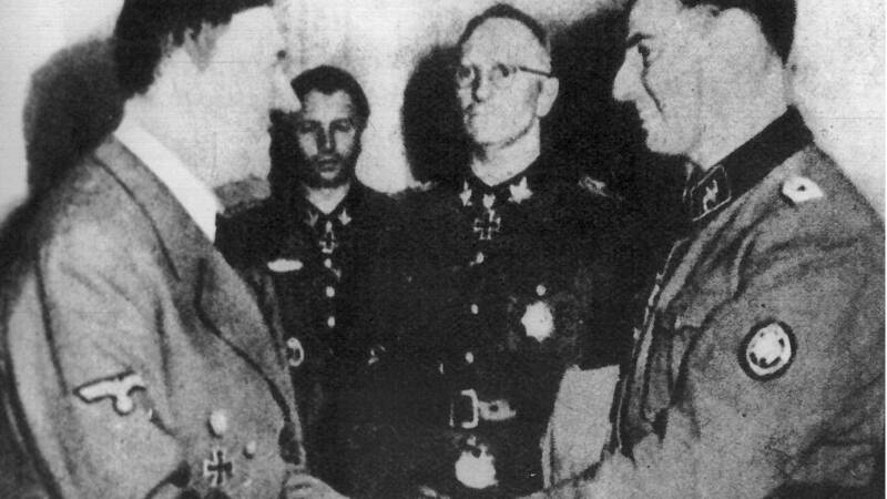 Belgian SS man Degrelle, at right, received by Hitler. AFP/BELGA photo
