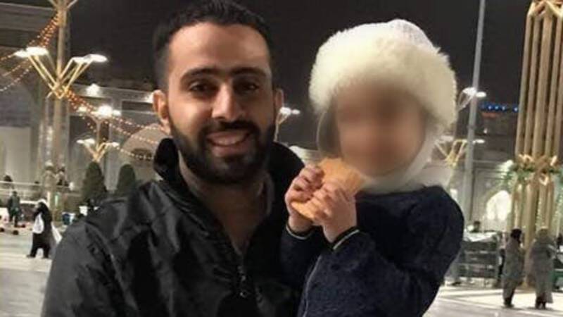 Ali Mohammed al-Showaikh with a child, Amnesty photo