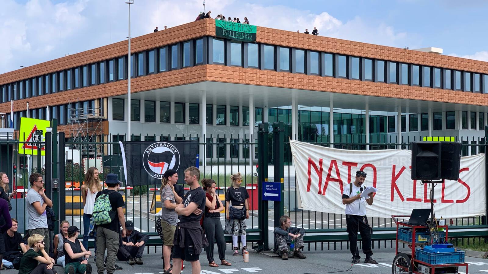 Activists at the NATO building in The Hague, the Netherlands, photo Robert Bas