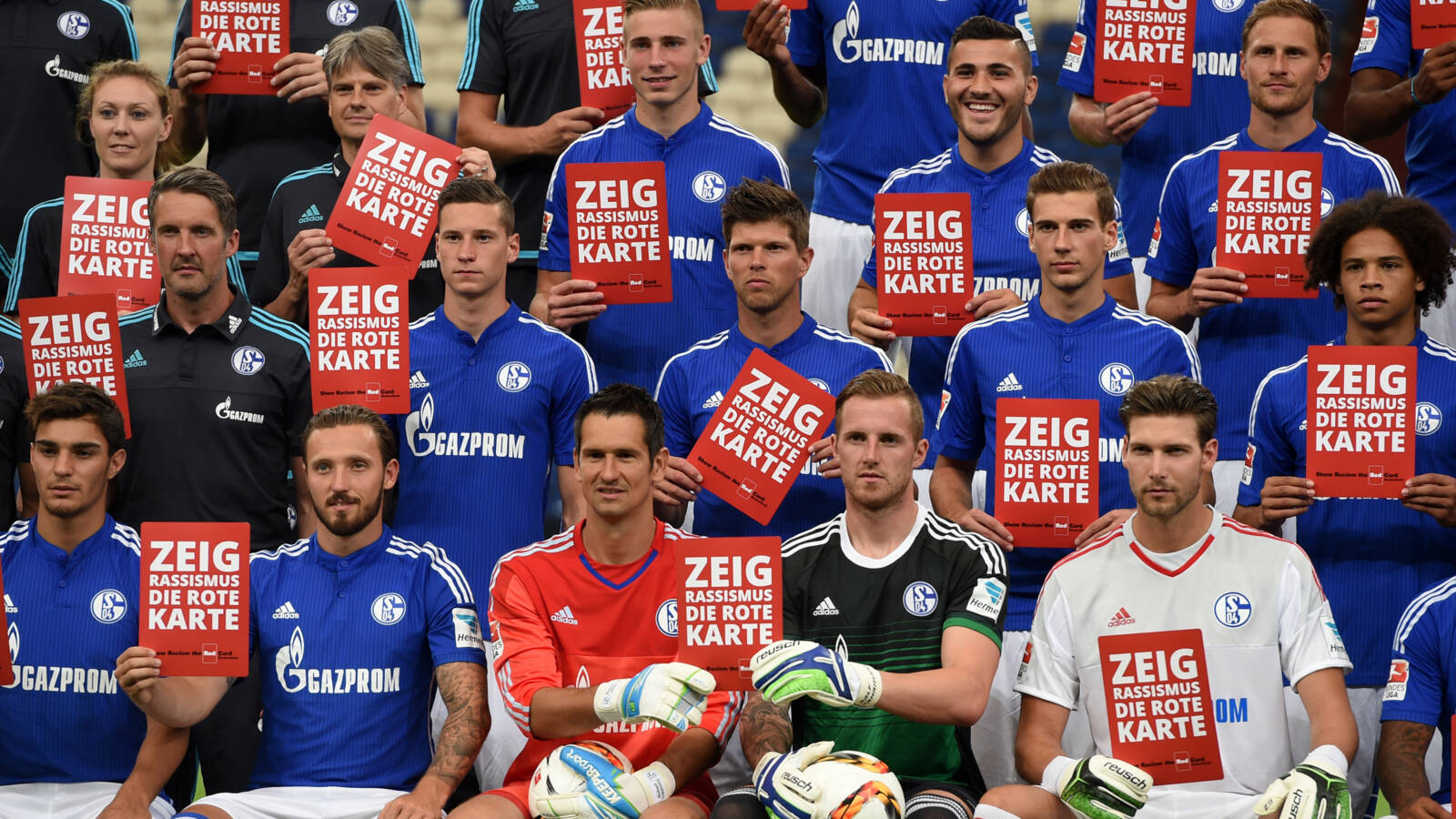 The Schalke team in 2015, with Show racism the red card signs