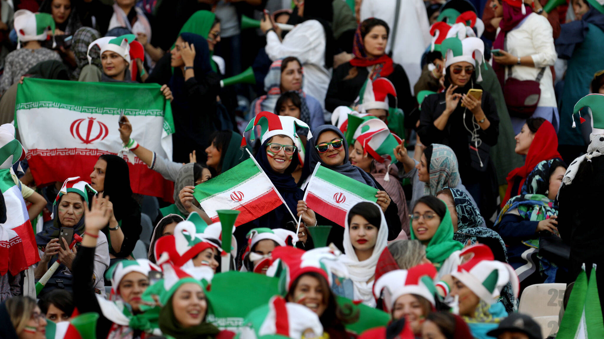 Iranian women supporters at Iran, Cambodia, photo by NOS / Marcel van der Steen
