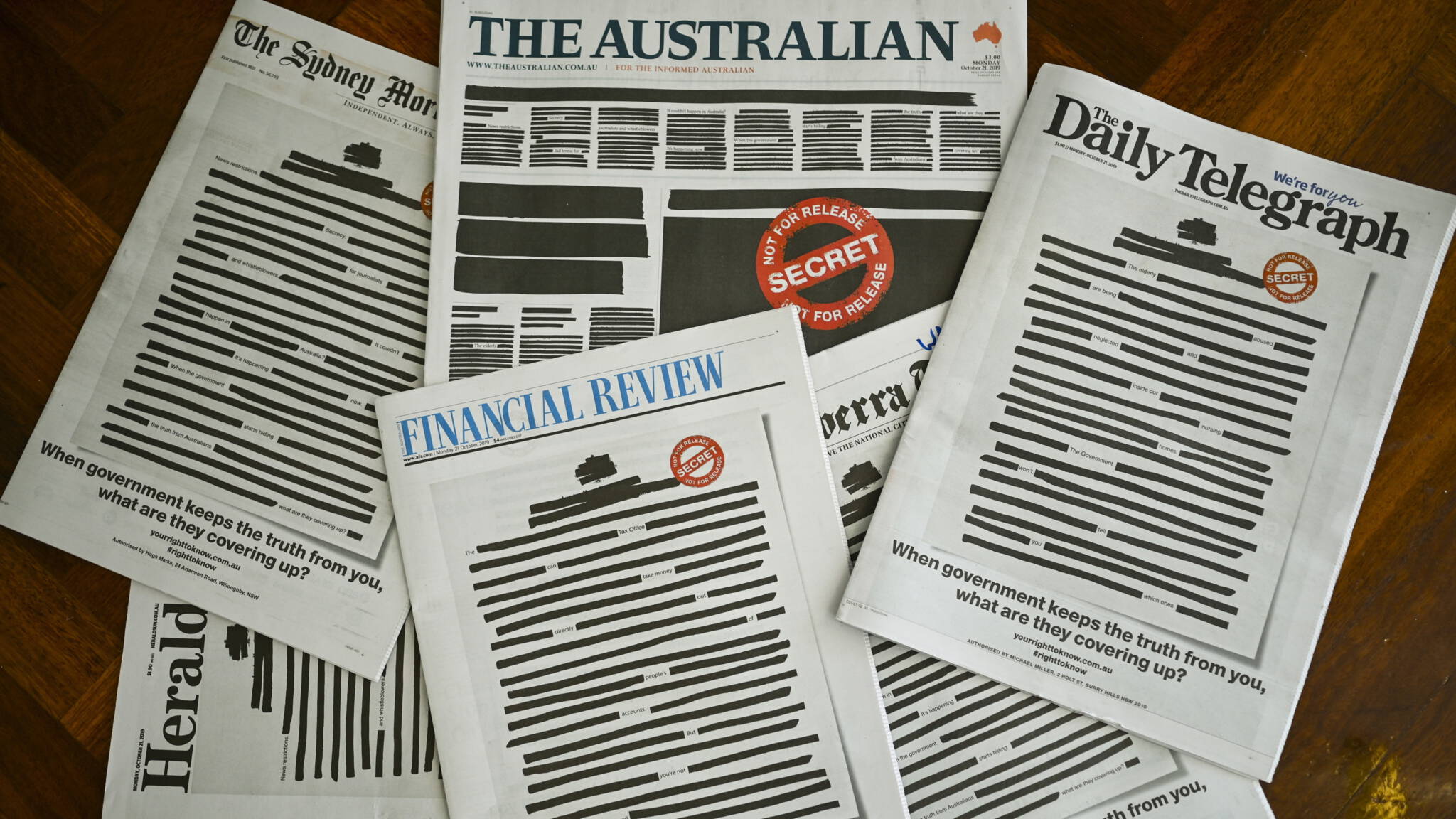 Australian newspapers' blackened front pages, in protest against government censorship, EPA photo